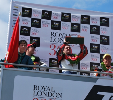 Michael Dunlop lifts the trophy after taking the win in the RL360 Superstock TT race